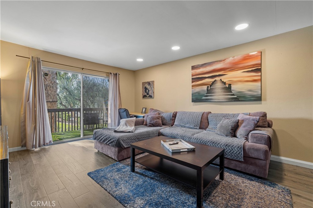23515 Lyons Avenue, Unit 277 Valencia, CA 91355 - Photo 3 of 29 a living room with furniture and a large window