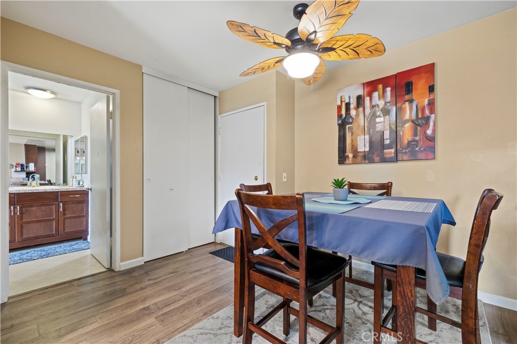 23515 Lyons Avenue, Unit 277 Valencia, CA 91355 - Photo 5 of 29 a view of a dining room with furniture and wooden floor