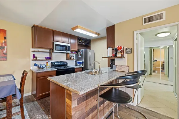 a kitchen with a table and chairs in it