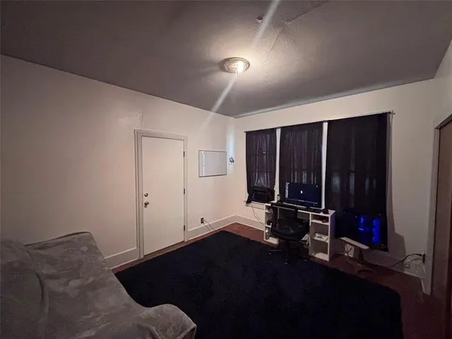 a room with furniture closet and a window