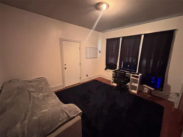 a bed sitting in a bedroom next to a room