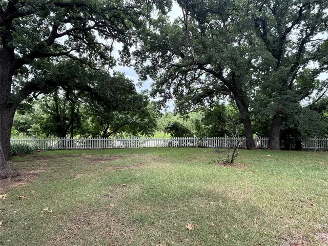 a view of outdoor space with deck and yard