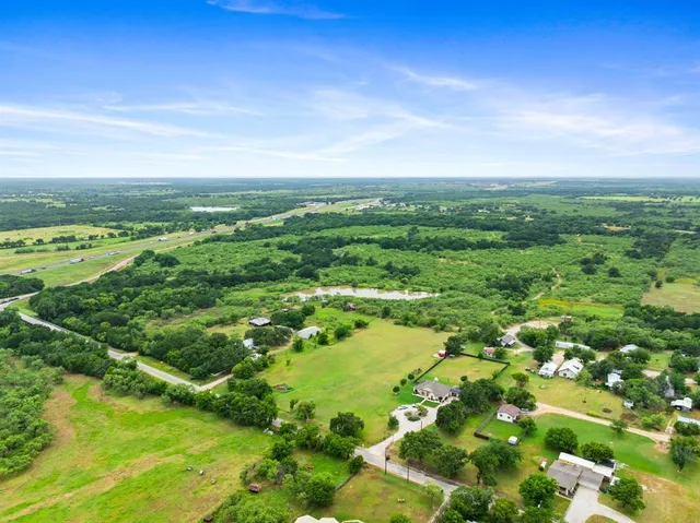 a view of lake with green space