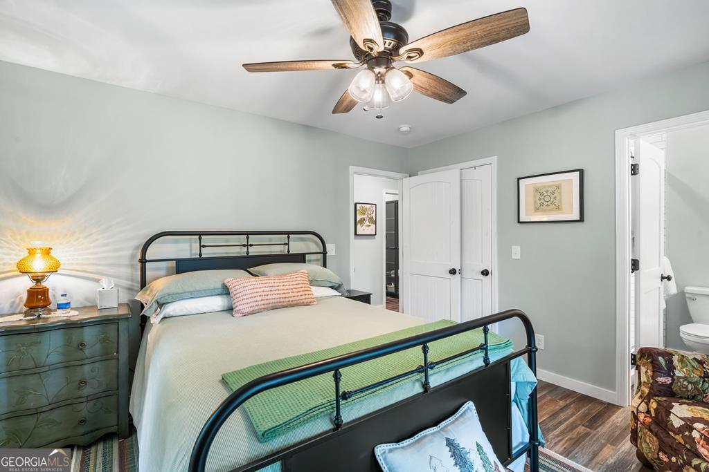 270 Hiawassee River Road Murphy, NC 28906 - Photo 20 of 50 a bedroom with a bed and a chandelier