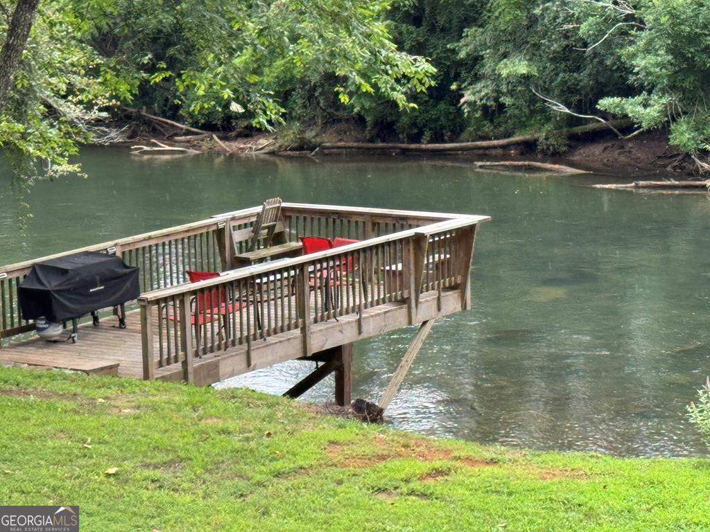 270 Hiawassee River Road Murphy, NC 28906 - Photo 2 of 50 a view of a lake with a deck
