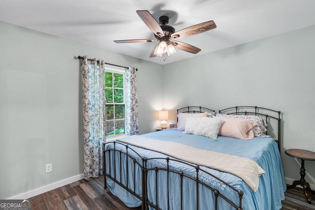 270 Hiawassee River Road Murphy, NC 28906 - Photo 21 of 50 a bedroom with a bed and a window