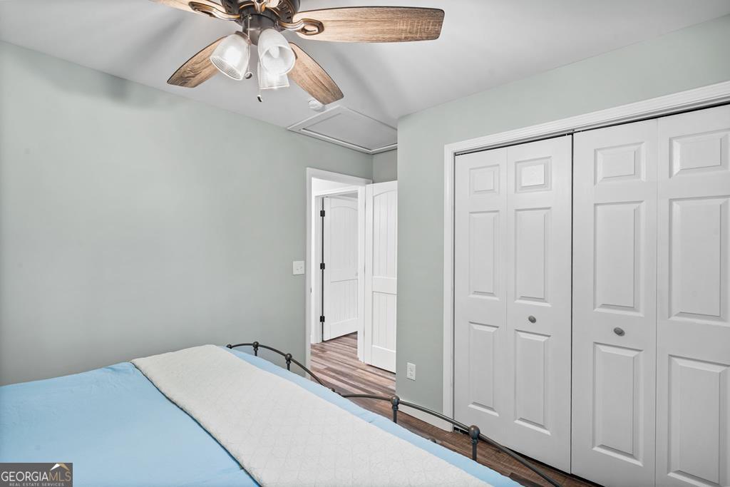 270 Hiawassee River Road Murphy, NC 28906 - Photo 22 of 50 a bedroom with a bed and a chandelier fan