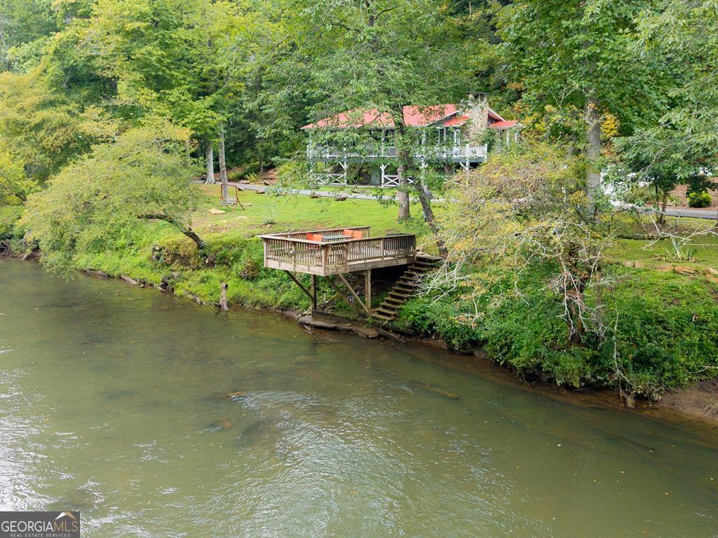 270 Hiawassee River Road Murphy, NC 28906 - Photo 3 of 50 a backyard of a house with a yard and outdoor seating