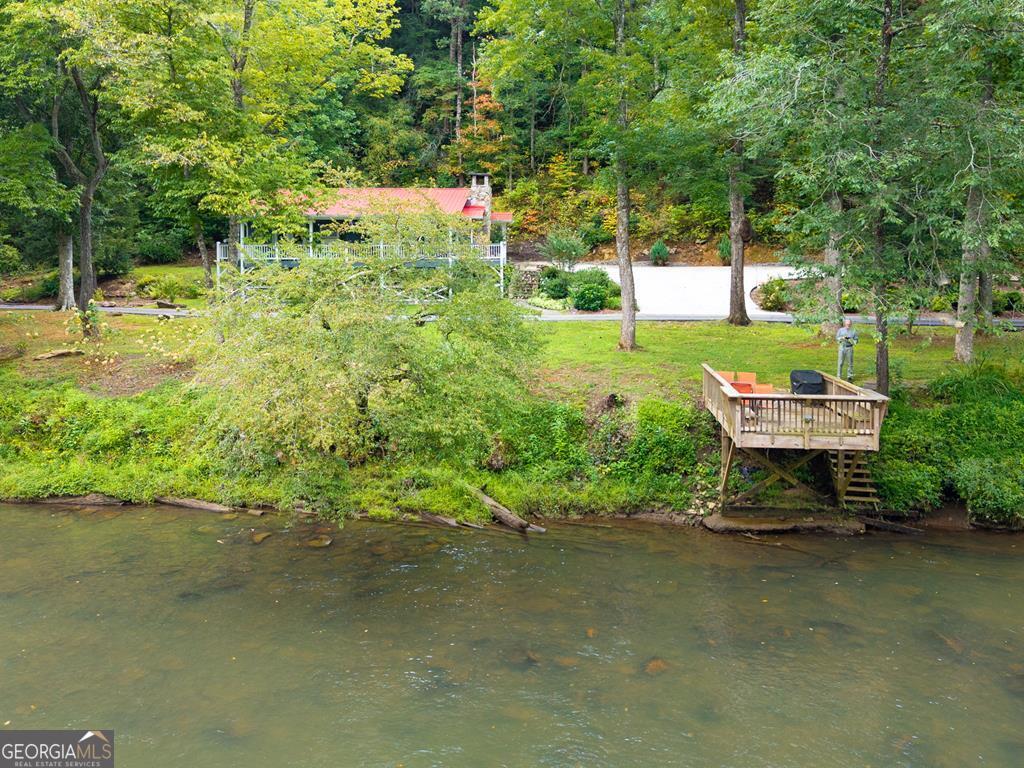 270 Hiawassee River Road Murphy, NC 28906 - Photo 37 of 50 a backyard of a house with yard and outdoor seating