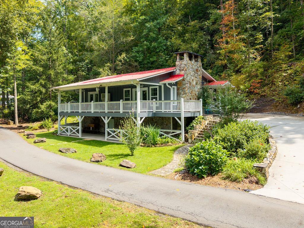 270 Hiawassee River Road Murphy, NC 28906 - Photo 39 of 50 a front view of a house with swimming pool and porch