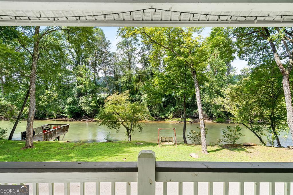 270 Hiawassee River Road Murphy, NC 28906 - Photo 5 of 50 a view of a yard with plants and a fountain