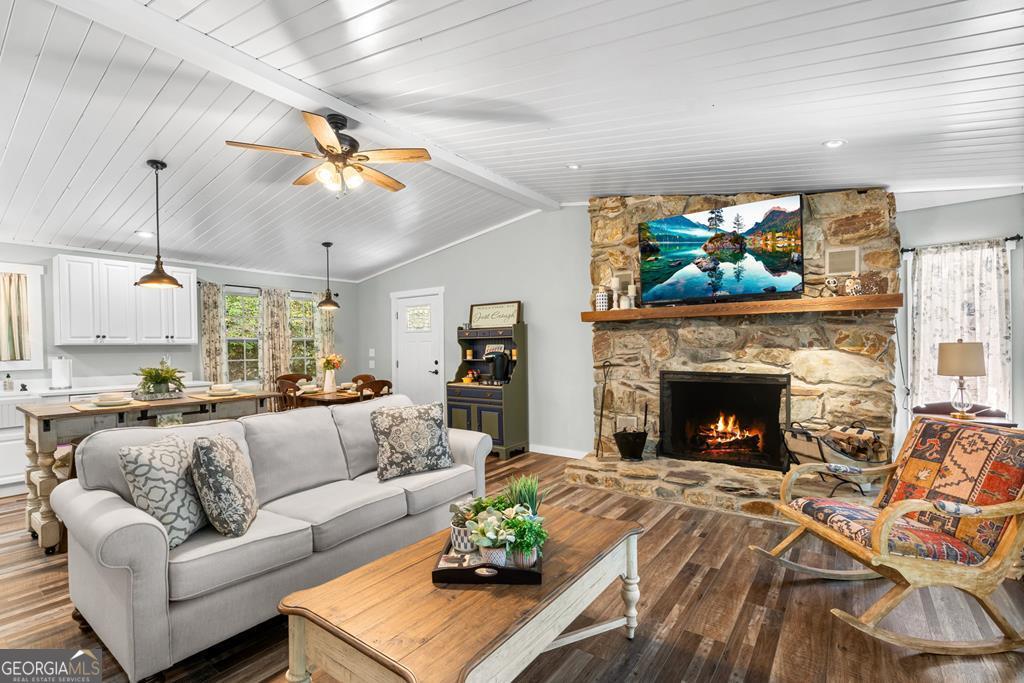270 Hiawassee River Road Murphy, NC 28906 - Photo 6 of 50 a living room with furniture a fireplace and a flat screen tv