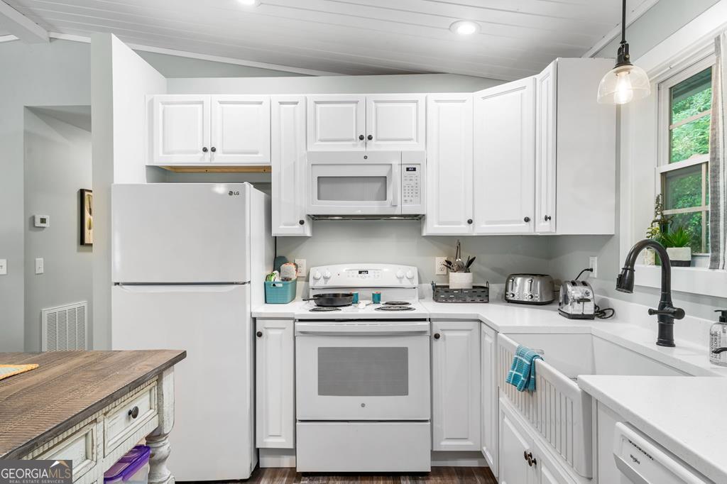270 Hiawassee River Road Murphy, NC 28906 - Photo 9 of 50 a kitchen with a white cabinets and white appliances