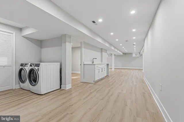a utility room with dryer and washer