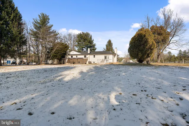 a view of yard covered with snow in outdoor space