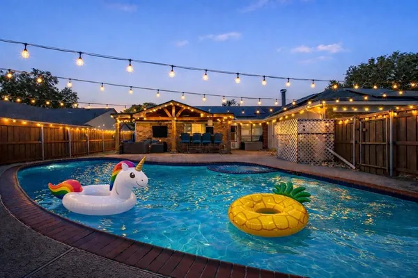 a view of a chairs and table in patio