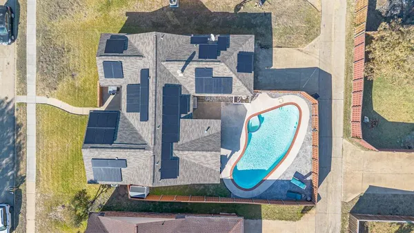 aerial view of a house with a swimming pool