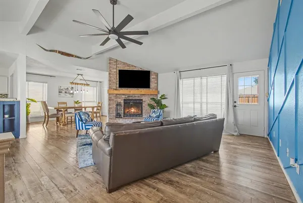 a living room with furniture and a flat screen tv