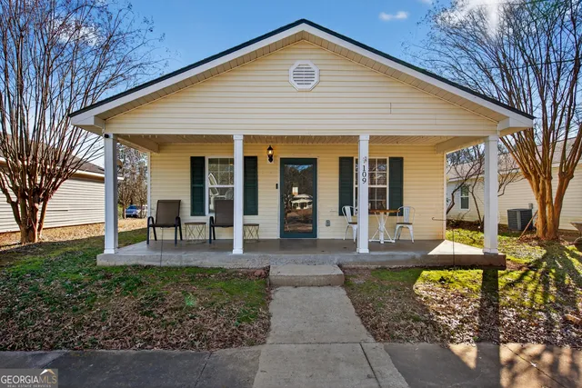 a front view of a house with garden