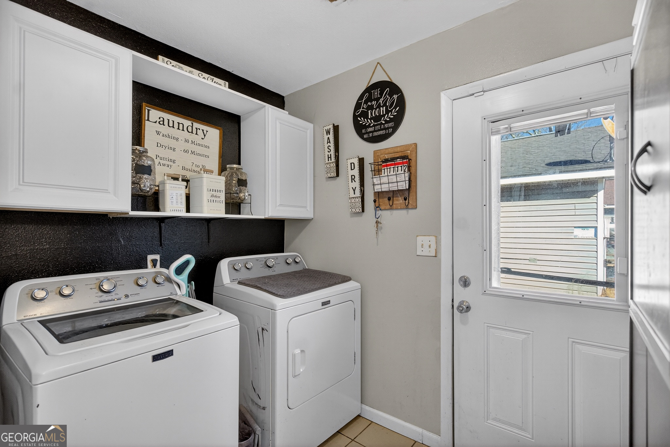 109 Garfield Street LaGrange, GA 30240 - Photo 11 of 14 a view of storage and utility room with washer and dryer