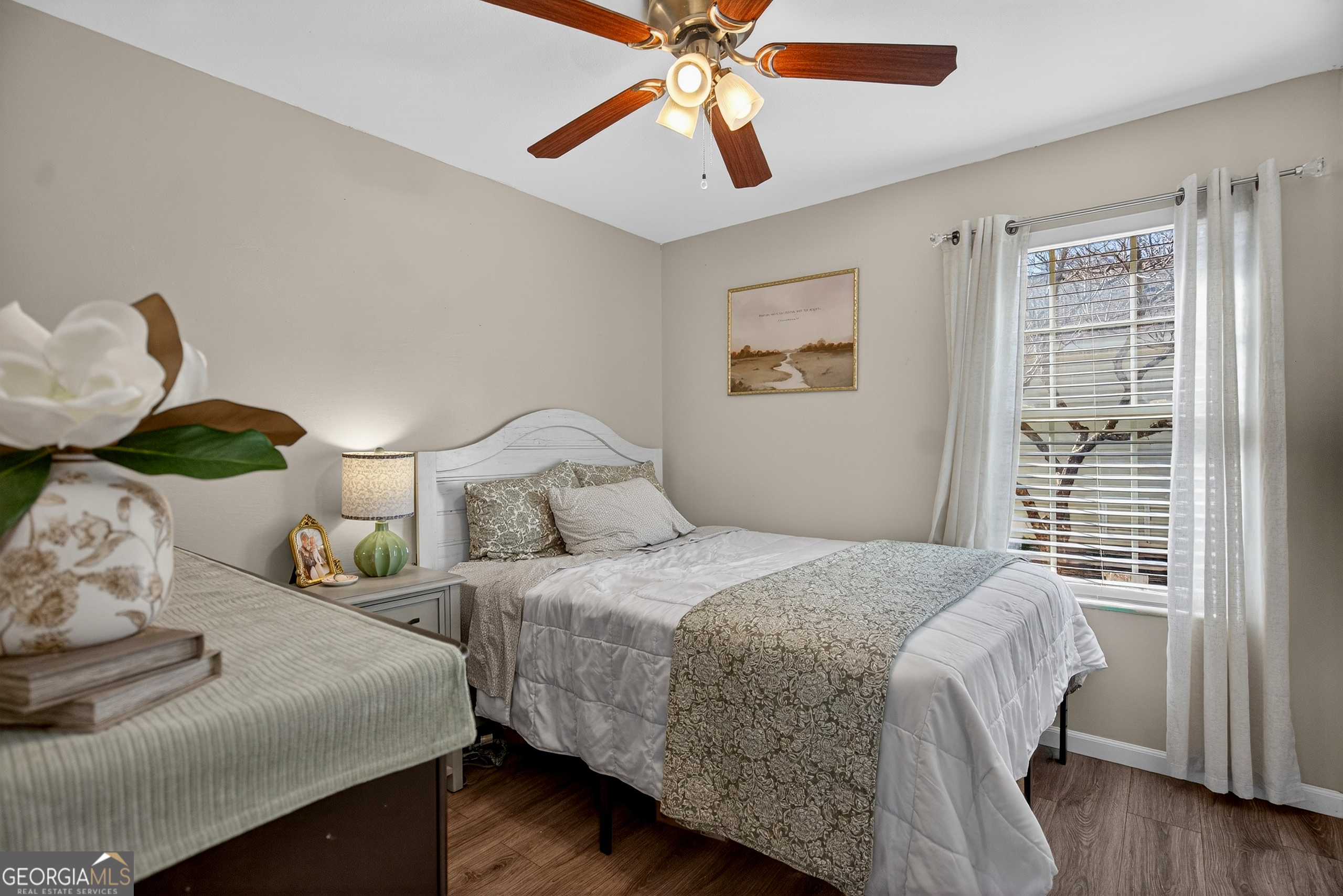 109 Garfield Street LaGrange, GA 30240 - Photo 13 of 14 a bedroom with a bed and wooden floor