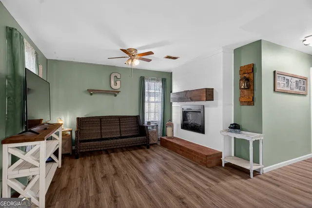 a living room with furniture and a fireplace