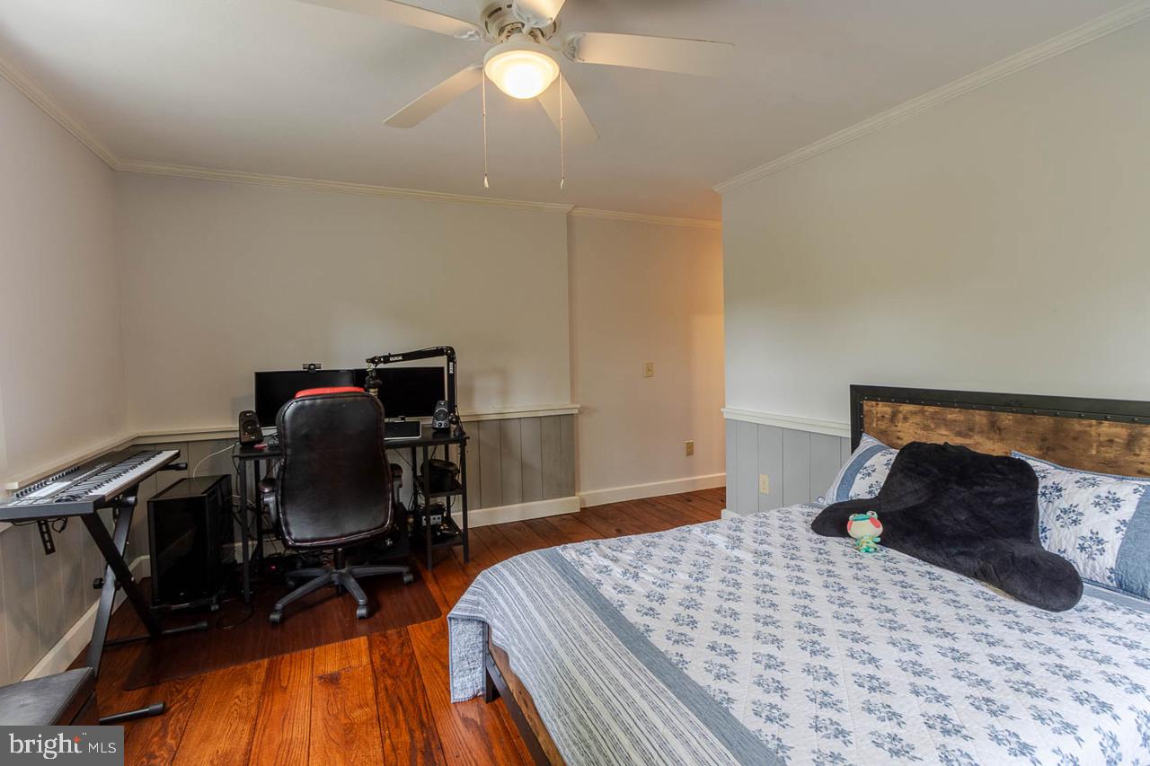 1834 Decker Hollow Road Tyrone, PA 16686 - Photo 25 of 40 a bedroom with a bed and a chandelier