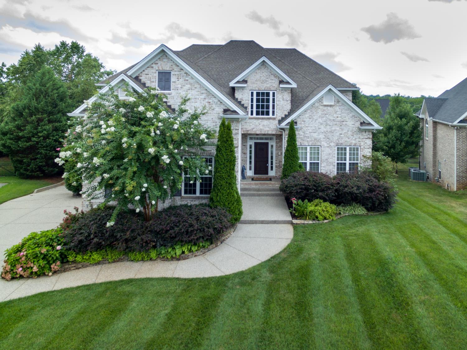 1621 Fair House Road Spring Hill, TN 37174 - Photo 1 of 30 a front view of a house with a yard