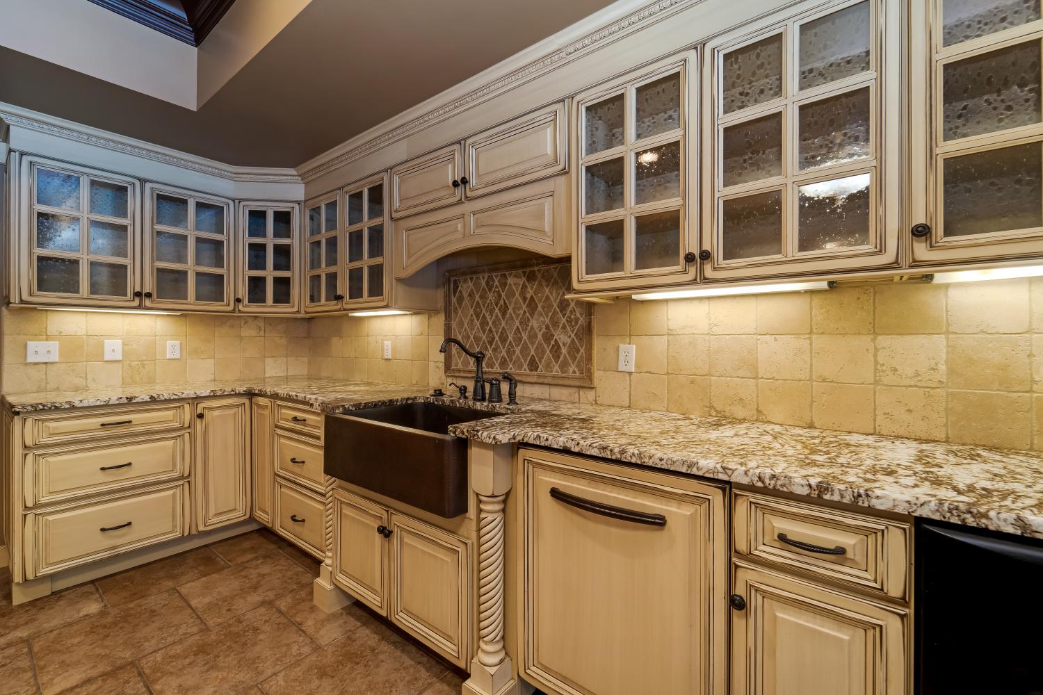 1621 Fair House Road Spring Hill, TN 37174 - Photo 14 of 30 a kitchen with granite countertop a sink and cabinets