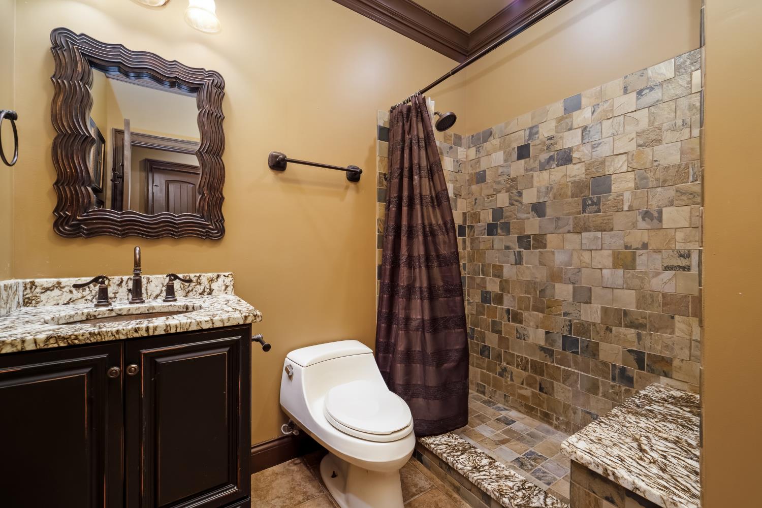 1621 Fair House Road Spring Hill, TN 37174 - Photo 18 of 30 a bathroom with a granite countertop toilet sink and mirror