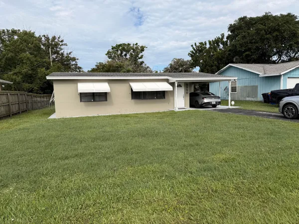 a view of a house with garage and kitchen