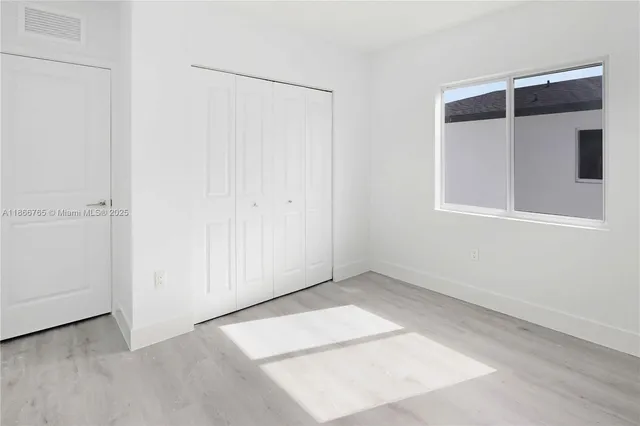 a kitchen with stainless steel appliances a refrigerator and a stove top oven