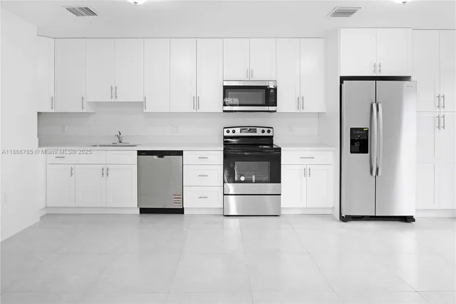 a bathroom with a bathtub and a toilet
