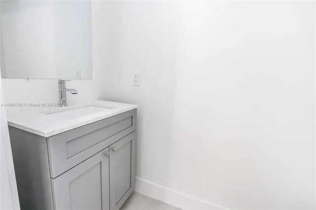 a bathroom with a sink a toilet and bathtub