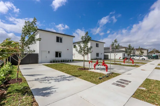 a front view of a building with garden