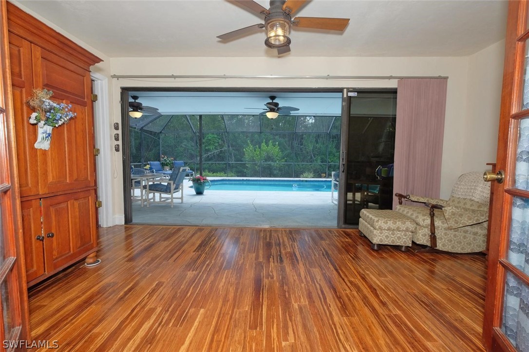 17485 Oriole Road Fort Myers, FL 33967 - Photo 15 of 35 a very nice looking room with a large window and wooden floor