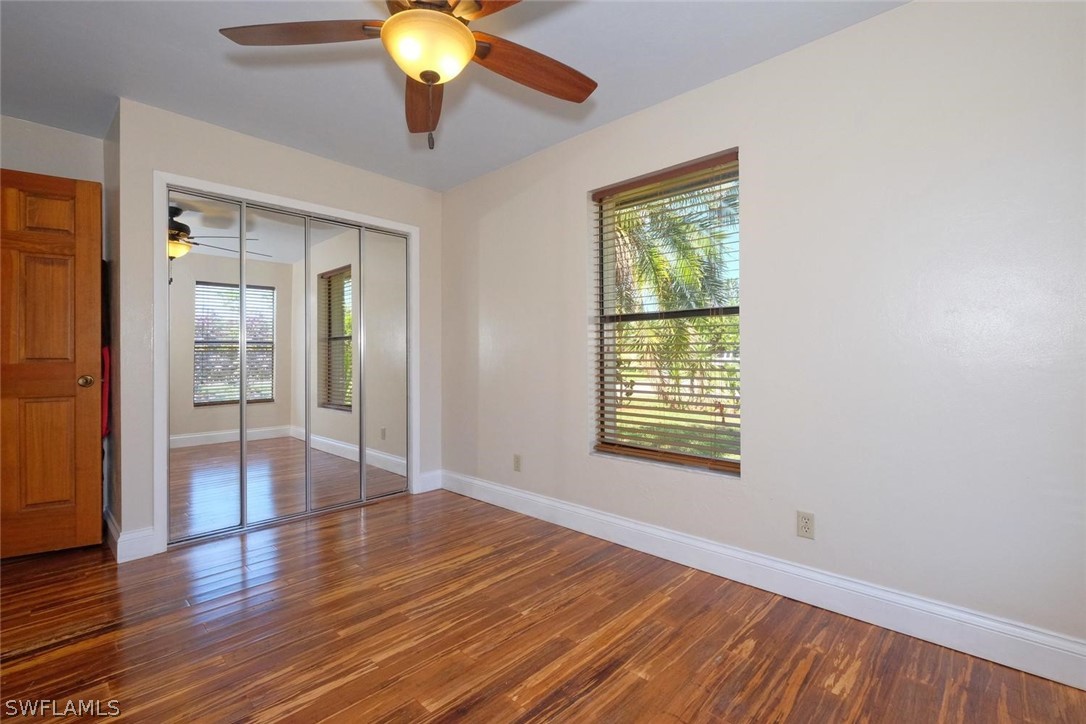 17485 Oriole Road Fort Myers, FL 33967 - Photo 27 of 35 a view of an empty room with wooden floor and a window
