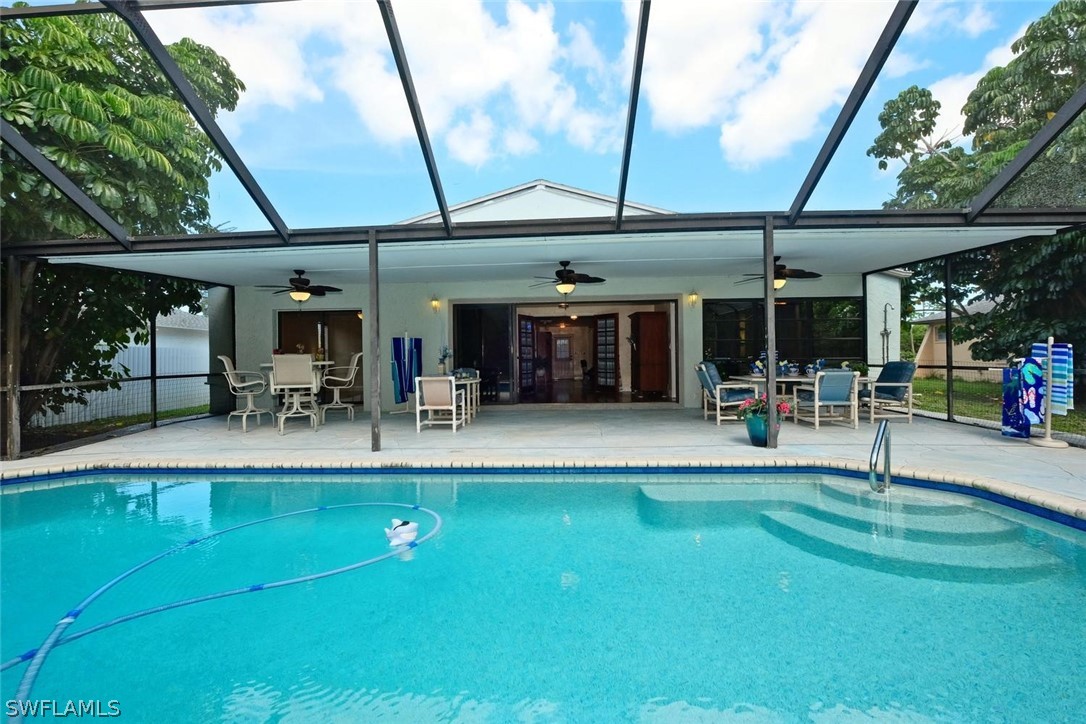 17485 Oriole Road Fort Myers, FL 33967 - Photo 33 of 35 a view of a chairs and table in patio with a barbeque