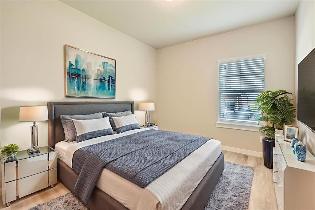 4425 Lassen Trail Forney, TX 75126 - Photo 5 of 6 a bedroom with bed and night stand