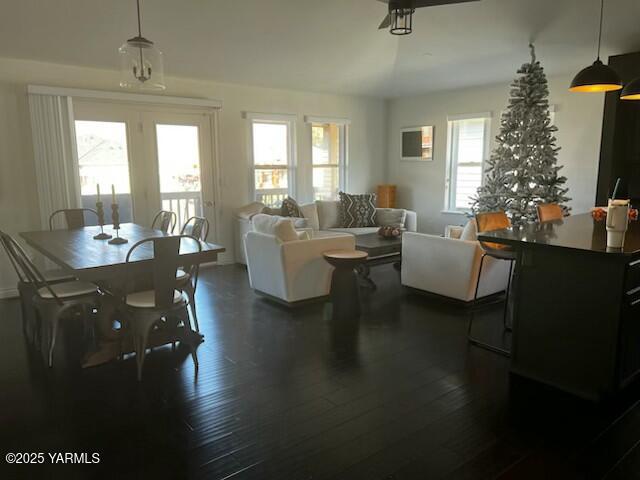 a living room with fireplace furniture and a potted plant