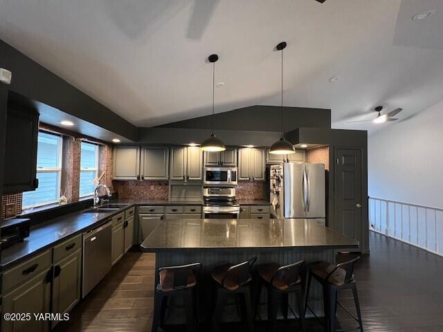 2005 Lakeview Drive Yakima, WA 98902 - Photo 13 of 35 a kitchen with stainless steel appliances a table chairs in it and wooden floors