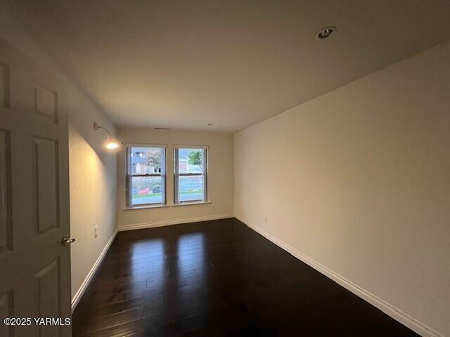 2005 Lakeview Drive Yakima, WA 98902 - Photo 24 of 35 an empty room with wooden floor and windows