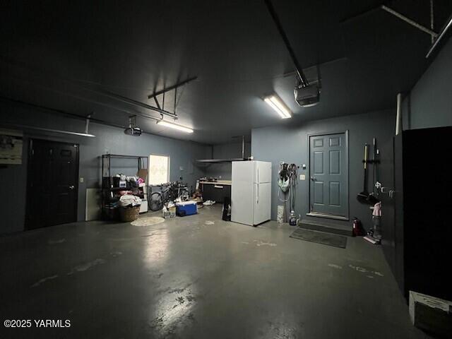 2005 Lakeview Drive Yakima, WA 98902 - Photo 27 of 35 a view of a room with gym equipment and a refrigerator