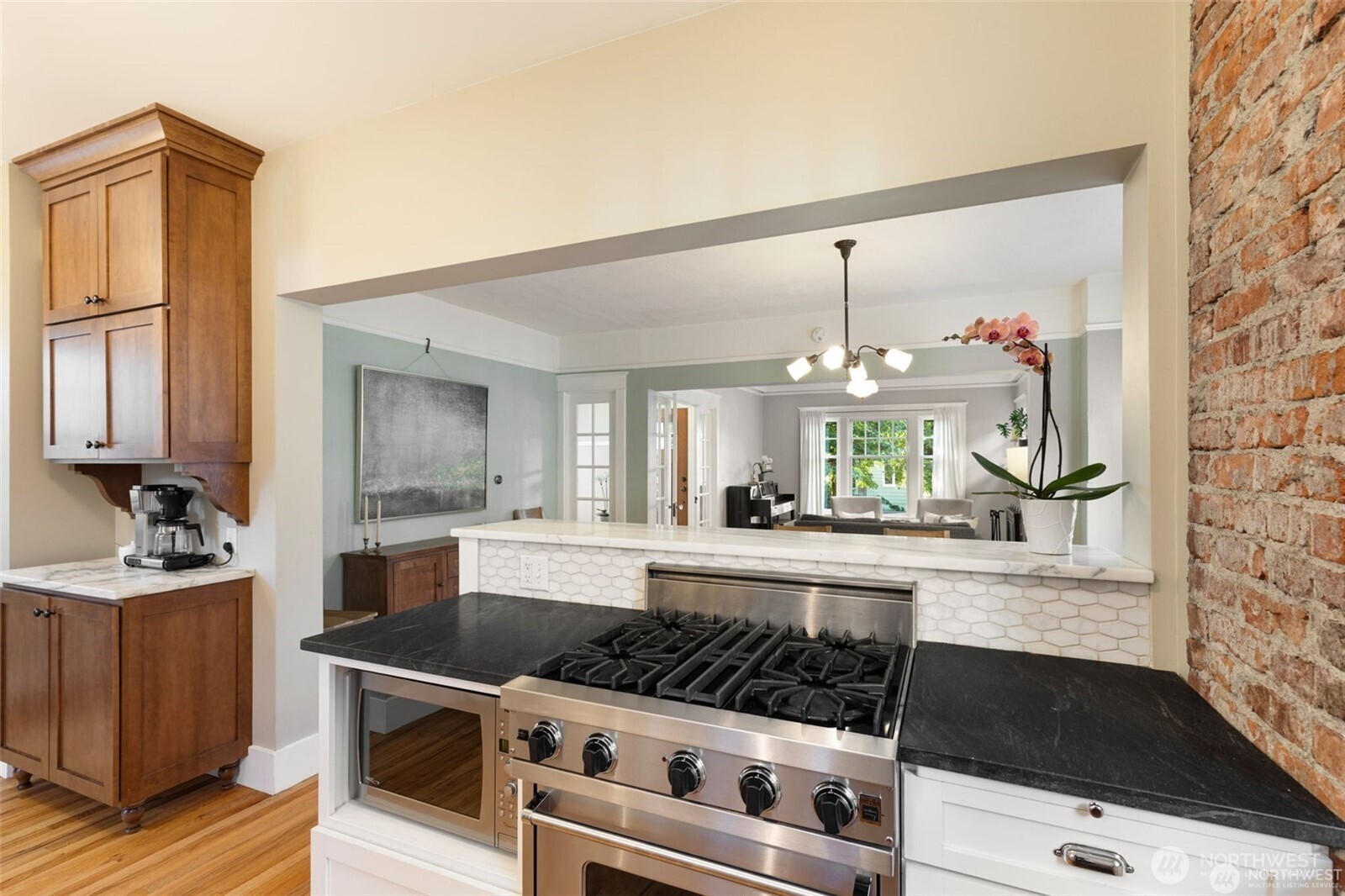2430 8th Avenue West Seattle, WA 98119 - Photo 12 of 34 a kitchen with stove and refrigerator