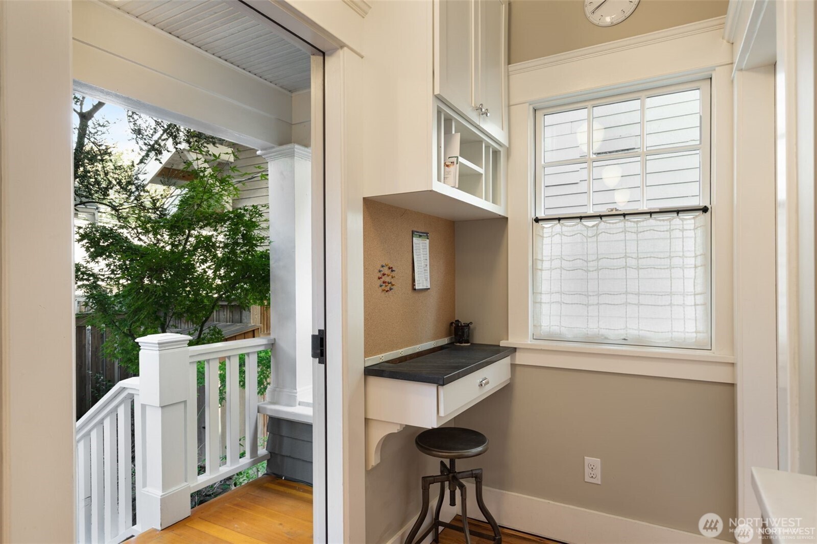 2430 8th Avenue West Seattle, WA 98119 - Photo 14 of 34 a view of a room that has a large window and wooden floor