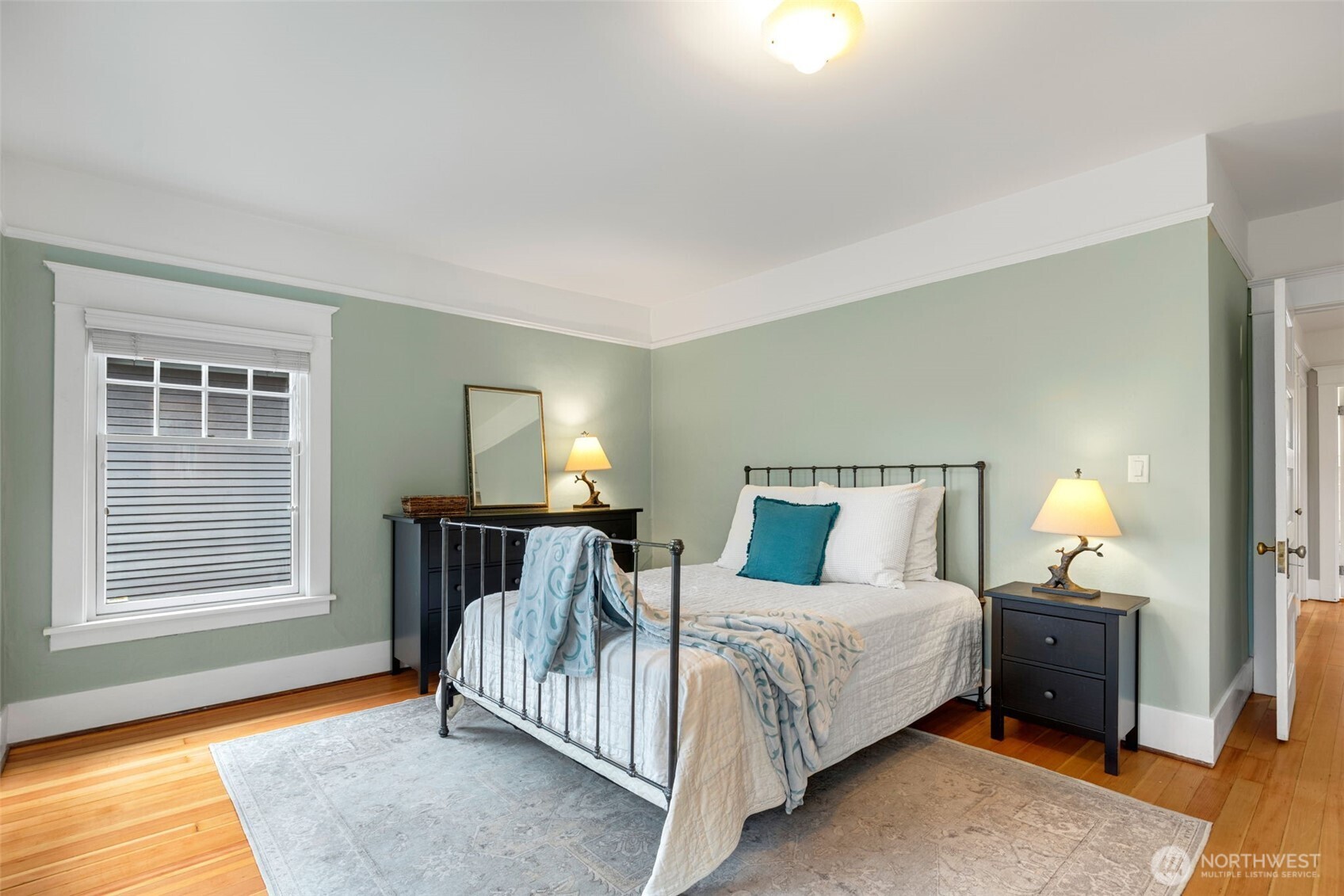 2430 8th Avenue West Seattle, WA 98119 - Photo 16 of 34 a bedroom with a bed and a window