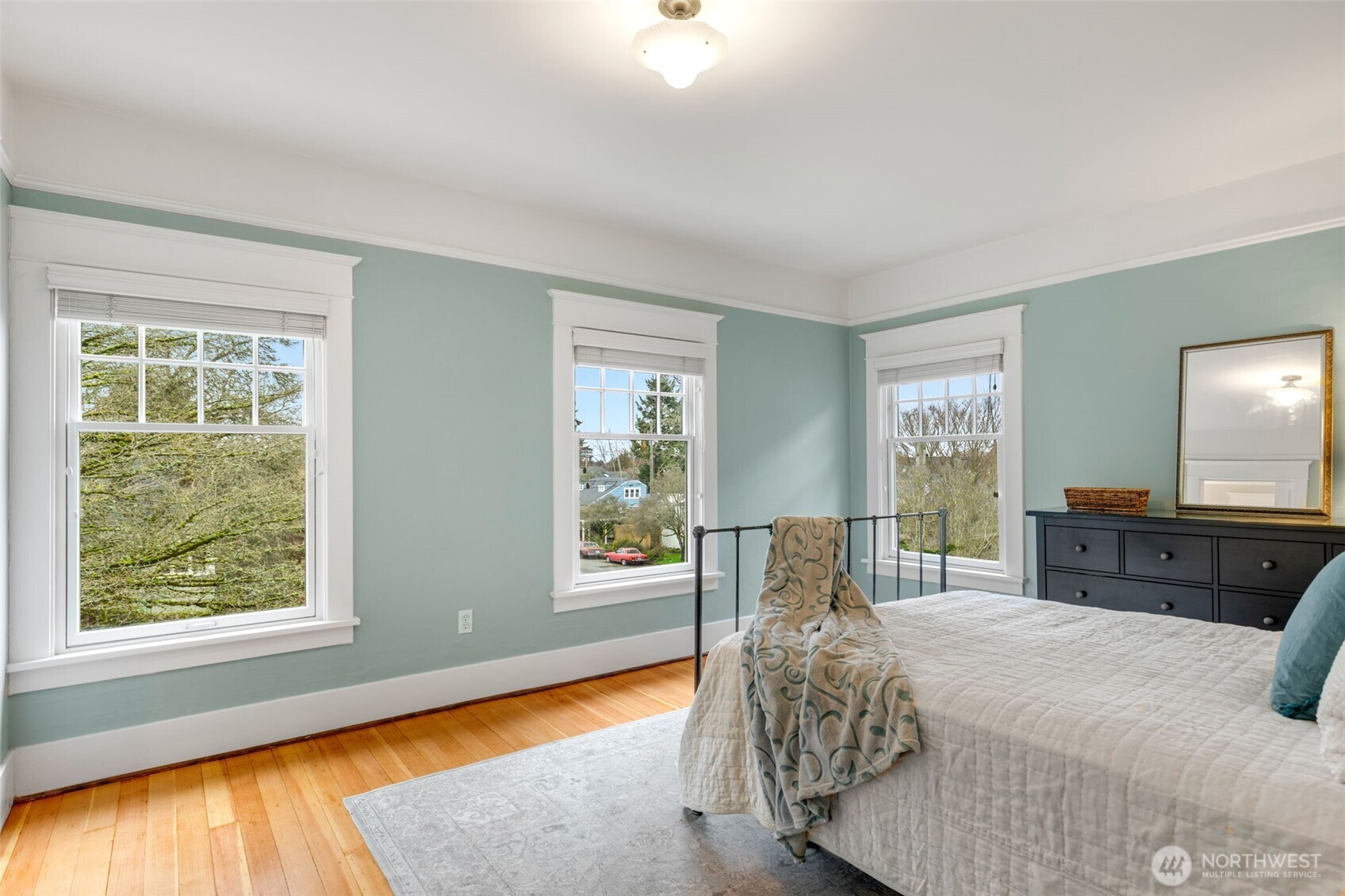 2430 8th Avenue West Seattle, WA 98119 - Photo 17 of 34 a bedroom with a bed and large windows