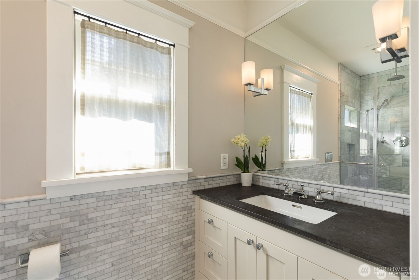 2430 8th Avenue West Seattle, WA 98119 - Photo 19 of 34 a bathroom with a sink and a mirror