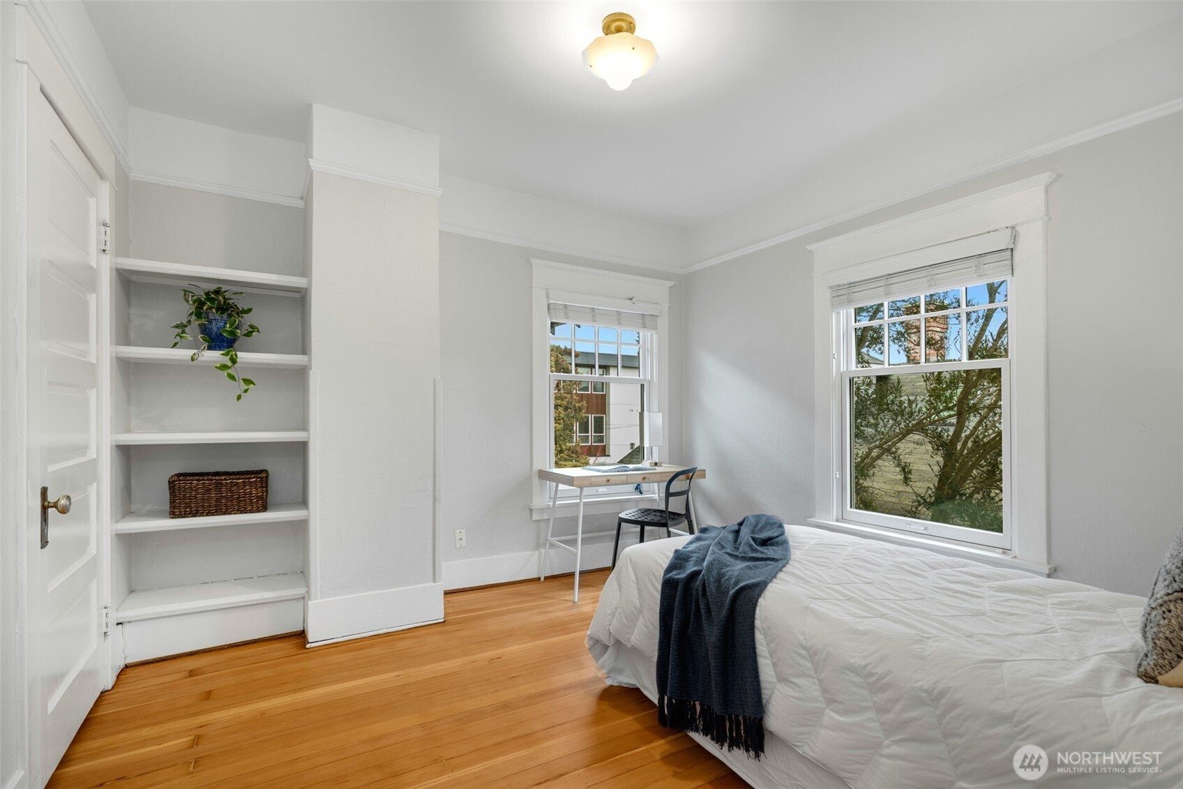 2430 8th Avenue West Seattle, WA 98119 - Photo 22 of 34 a bed room with a bed and a window