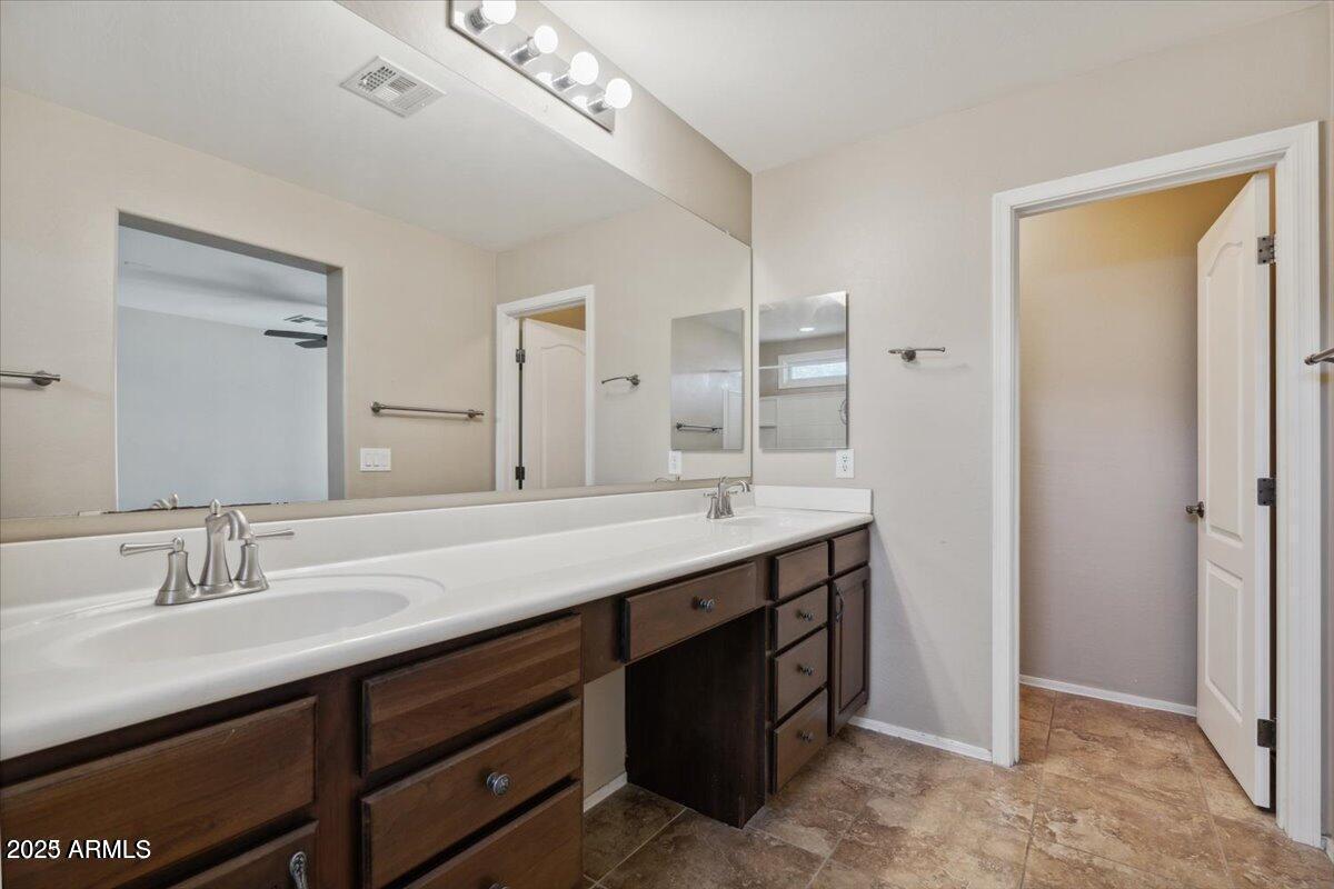 2233 East Pecan Road Phoenix, AZ 85040 - Photo 12 of 18 a bathroom with a double vanity sink and a mirror